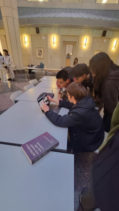 Feodor Yevtushenko explaining a problem to other contestants
