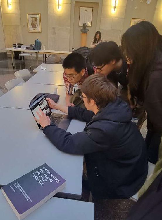 Feodor Yevtushenko explaining a problem to other contestants